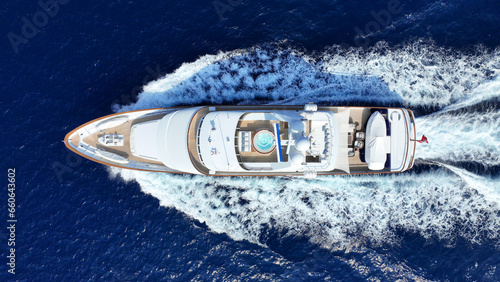 Aerial drone photo of latest technology mega yacht with wooden deck cruising deep blue Mediterranean sea © aerial-drone