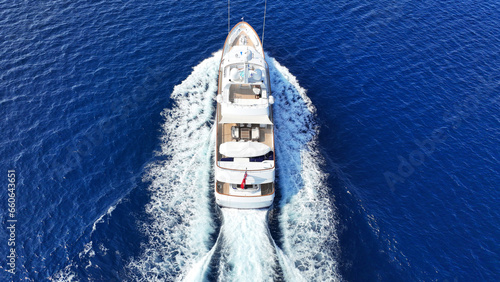 Aerial drone photo of latest technology mega yacht with wooden deck cruising deep blue Mediterranean sea © aerial-drone