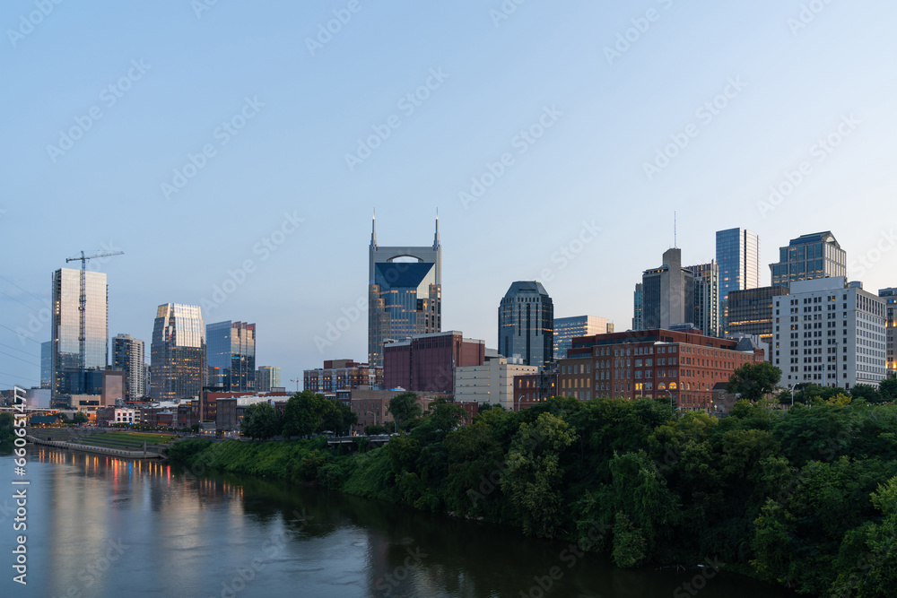 Panoramic skyline view of Broadway district of Nashville over Cumberland River at day time, Tennessee, USA. This city is known as a center for the music industry, especially country music