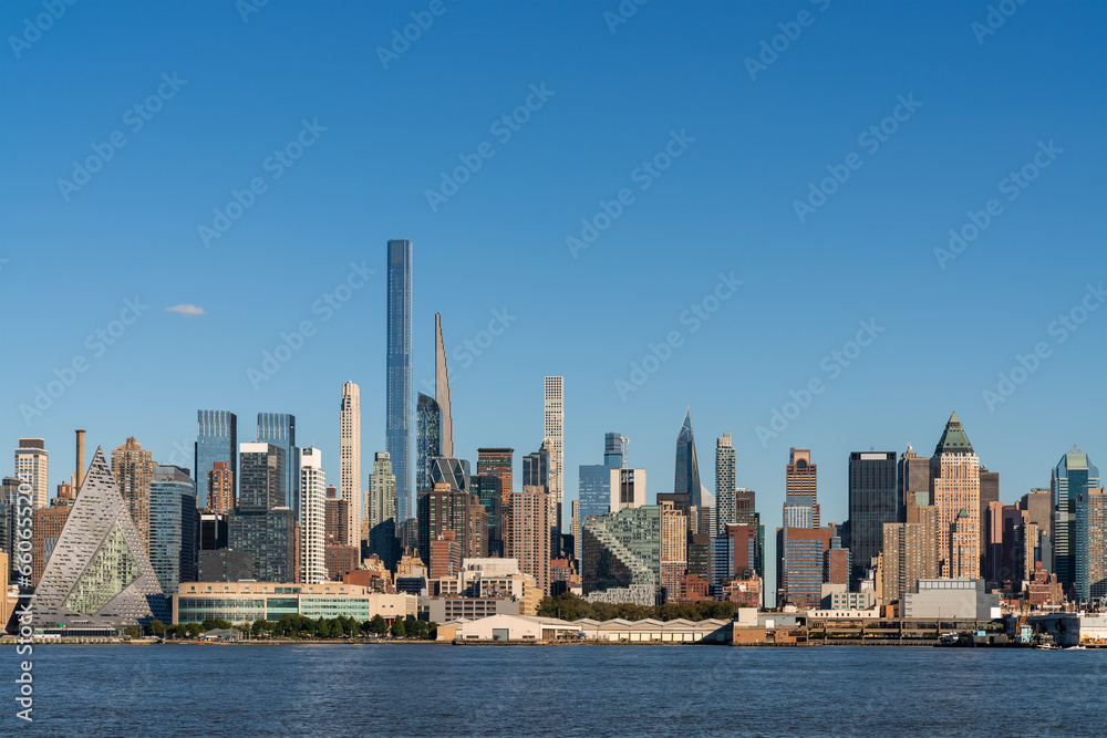 New York City skyline from New Jersey over the Hudson River with the skyscrapers at day time. Manhattan, Midtown, NYC, USA. A vibrant business neighborhood