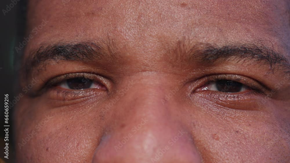 One black man macro close-up of eyes with serious neutral expression, looking at camera extreme detail One black man macro close-up of eyes with serious neutral expression, looking at camera extreme detail
