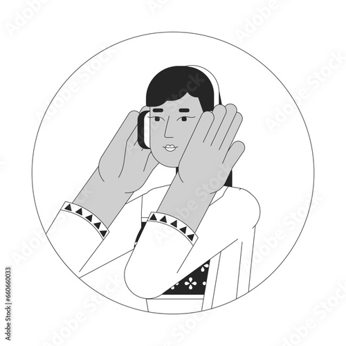 Headphones indian young adult woman black and white 2D vector avatar illustration. South asian lady listening to music outline cartoon character face isolated. Happy melomaniac flat user profile image