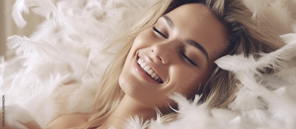 Young Woman Sleeping In Bed with smile. Portrait of Beautiful Woman Resting On Comfortable Bed With Pillow