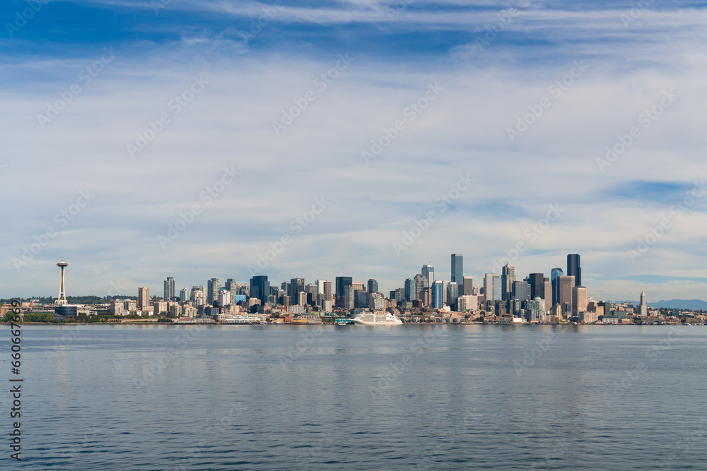 Waterfront Seattle skyline with Great wheel view. Skyscrapers of financial downtown at day time, Washington, USA. A vibrant business neighborhood Waterfront Seattle skyline with Great wheel view. Skyscrapers of financial downtown at day time, Washington, USA. A vibrant business neighborhood