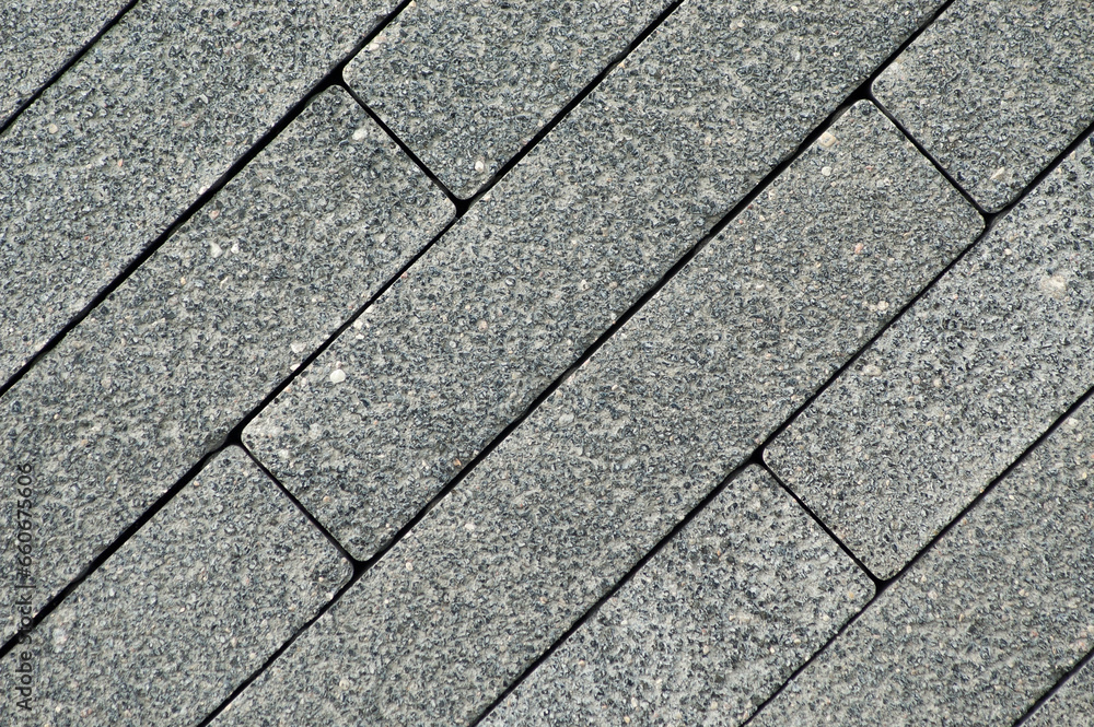 gray decorative paving slabs made of rectangular blocks laid out diagonally close-up gray decorative paving slabs made of rectangular blocks laid out diagonally close-up