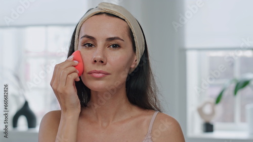 Картината върху платно Pov morning lady makeup routine at bathroom