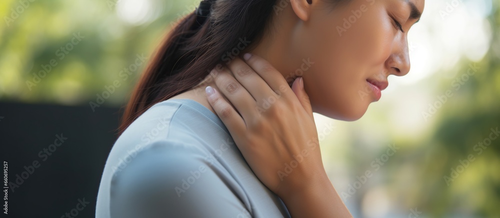 The woman suffers from pain in the neck joints - obrazy, fototapety, plakaty 