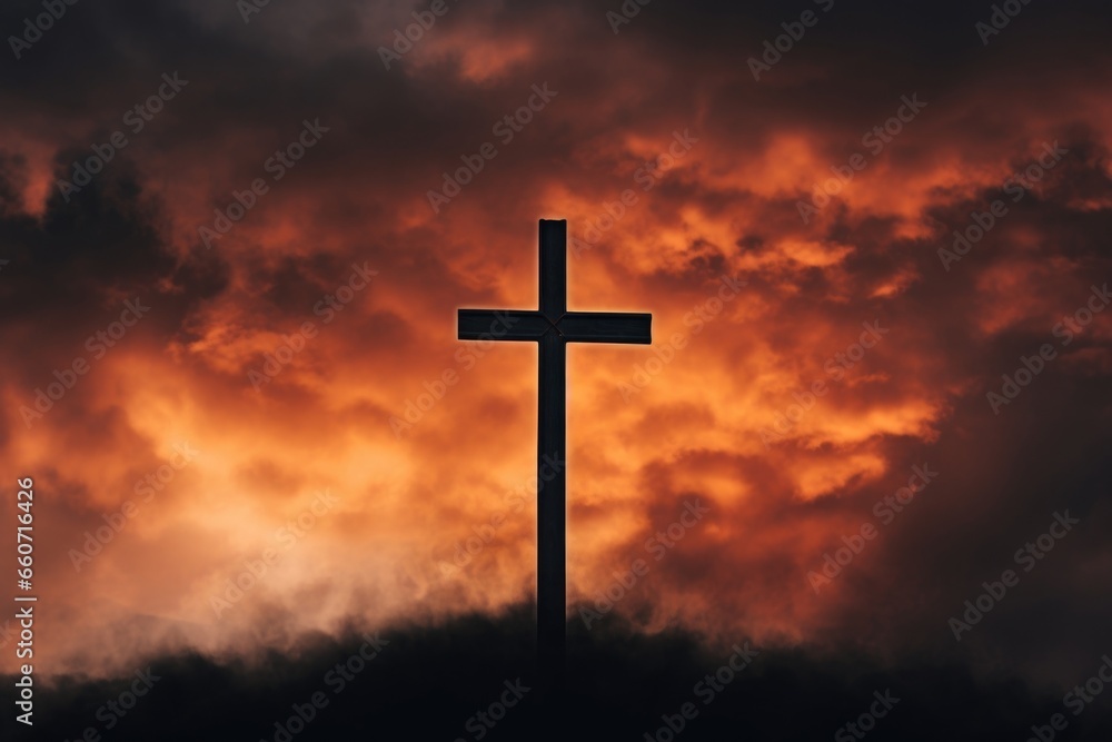 The cross stands out starkly against the fiery clouds, its dark silhouette a powerful symbol of the depth of Christs suffering.