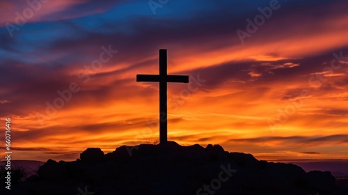 The vibrant colors of the sunset create a stunning backdrop for the cross, highlighting its significance and power. © Justlight