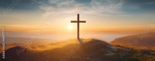 The soft, golden light of the sunrise casting a warm glow on the cross, giving it a serene and sacred aura.
