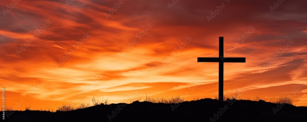 A stunning contrast between the stark, dark outline of the cross and the vibrant, golden background of the evening sky, creating a captivating composition. A stunning contrast between the stark, dark outline of the cross and the vibrant, golden background of the evening sky, creating a captivating composition.