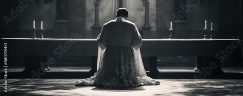 A concept photo of a priest bowing before the altar, where the Eucharist is being prepared, as a sign of humility and acceptance of Christs sacrifice. photo