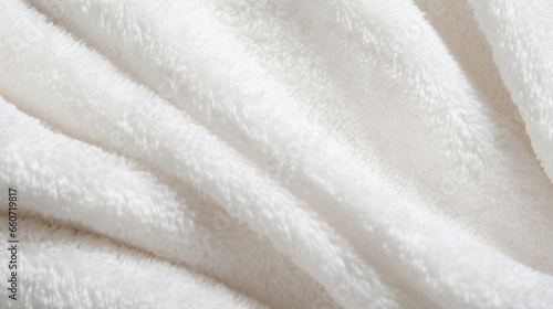 Closeup of a thick and luxurious cotton terrycloth texture, known for its high water absorption and ideal for bath towels and robes.