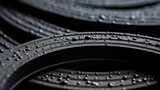 Closeup of a grooved rubber gasket, with a textured surface made up of small, circular indentations. The rubber creates a tight seal between two surfaces and is resistant to extreme temperatures.