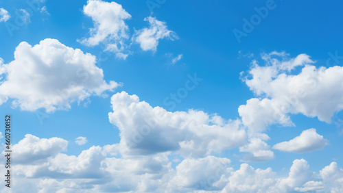 Fluffy Clouds over Azure Sky - Tranquil and Vibrant Atmospheric Beauty