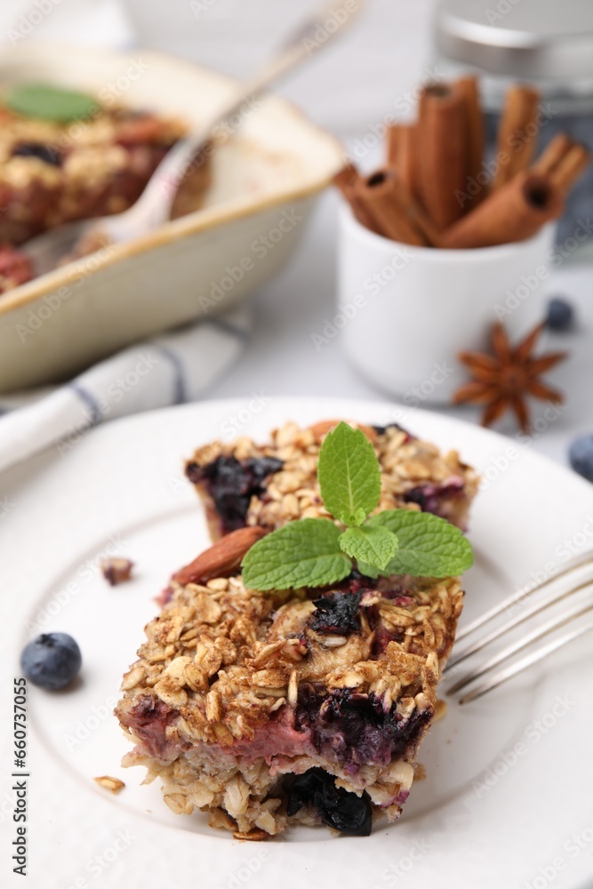 Fototapeta premium Tasty baked oatmeal with berries on table, closeup