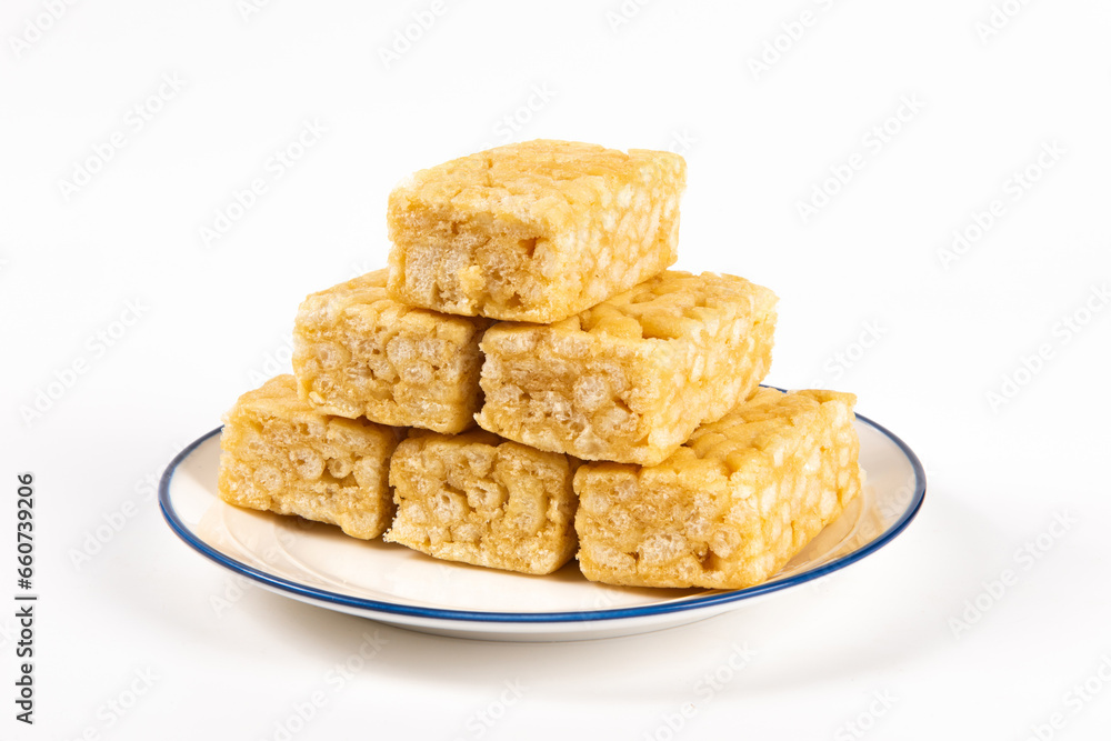 Chinese traditional dessert caramel treats or sachima isolated on white background. Chinese traditional dessert caramel treats or sachima isolated on white background.