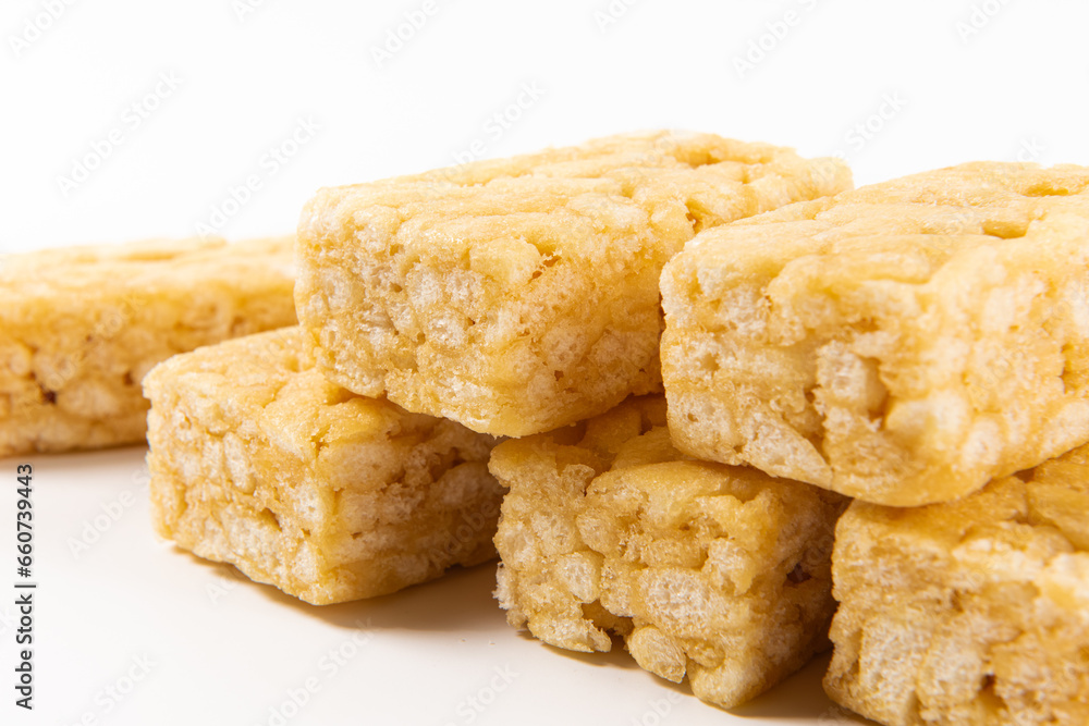 Chinese traditional dessert caramel treats or sachima isolated on white background. Chinese traditional dessert caramel treats or sachima isolated on white background.
