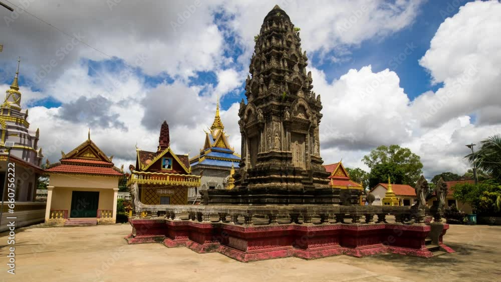 Angkorian like temple structure in pagoda, a place of worship during fluffy monsoon clouds building on blue sky. Siem Reap, Cambodia religious sight, motion control time lapse. Angkorian like temple structure in pagoda, a place of worship during fluffy monsoon clouds building on blue sky. Siem Reap, Cambodia religious sight, motion control time lapse.