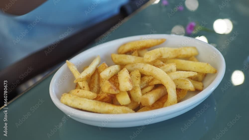  child hand pick french fries close up 