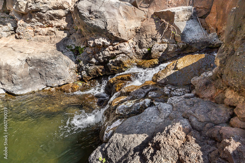 The small  waterfall on the Zavitan stream flows into the Yehudia National Natural Park in northern Israel