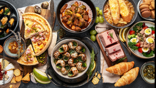 Traditional french food -mussel and meat dishes, ratatouille, snails, croissants, desserts, fresh pastries and cheese.