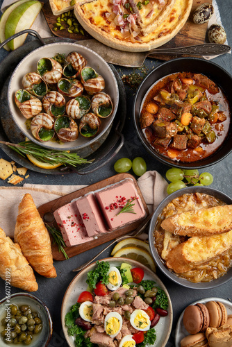 Traditional french food -mussel and meat dishes, ratatouille, snails, croissants, desserts, fresh pastries and cheese.