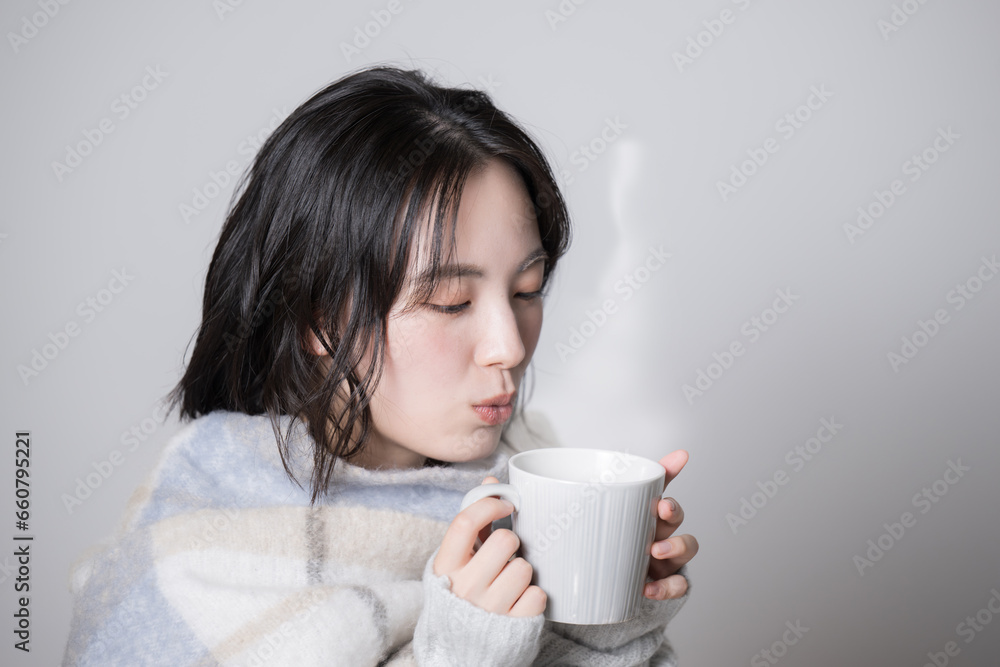 Young woman with a mug Image of cold and winter Young woman with a mug Image of cold and winter