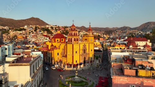 Aerial view ascending in front of the Basilica of Guanajuato, sunset in Mexico photo