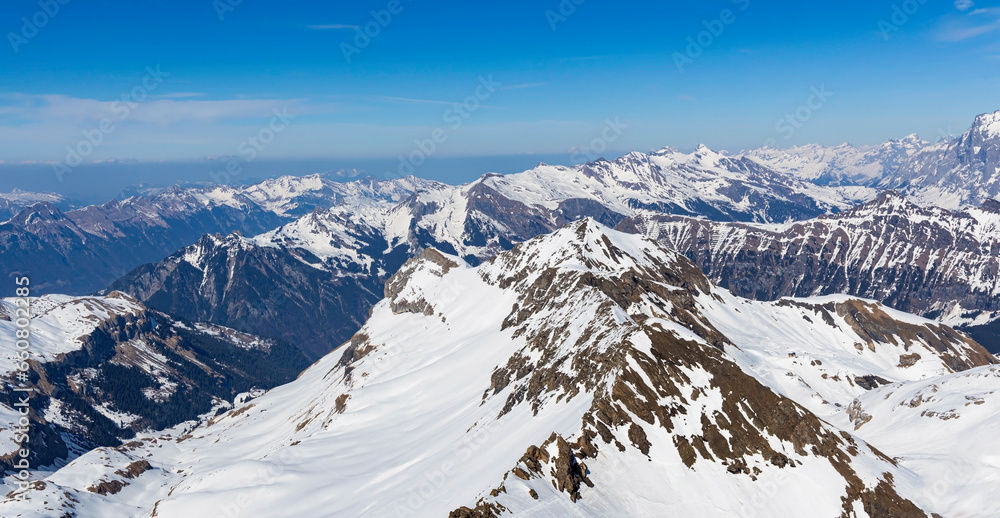 The mountain view of  alpine as snow-capped mount peaks in  Winter mountains