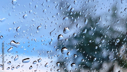 Water droplets on the glass on a natural background  photo