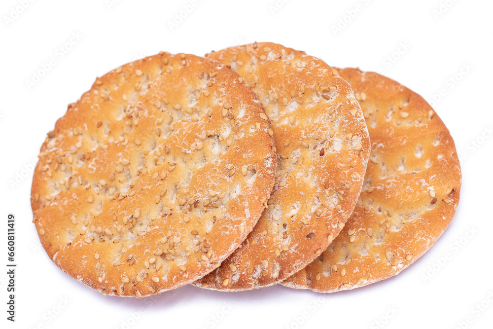 A Heap of Round Salt Crackers with Sesame Isolated on White Background. Dry Snacks - Isolation A Heap of Round Salt Crackers with Sesame Isolated on White Background. Dry Snacks - Isolation