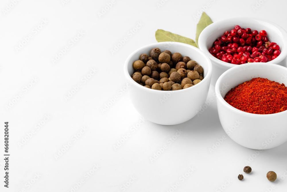 Various spices in a bowls on white background Various spices in a bowls on white background