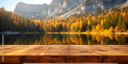The empty wooden table top with blur background of lake and mountain in autumn. Exuberant image. generative ai