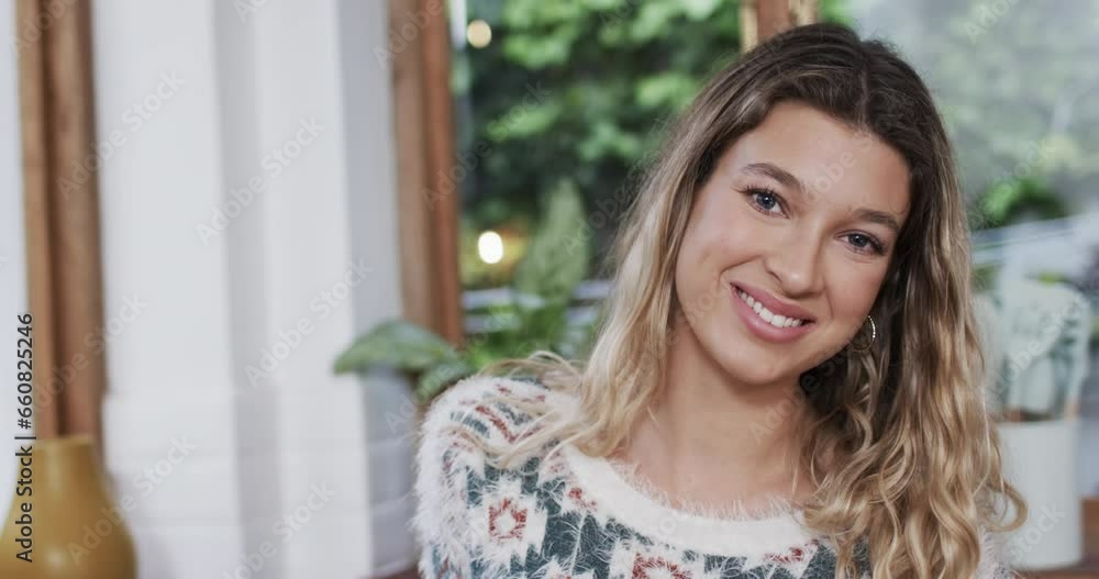 Portrait of happy biracial woman with blonde hair at home, slow motion, copy space Portrait of happy biracial woman with blonde hair at home, slow motion, copy space