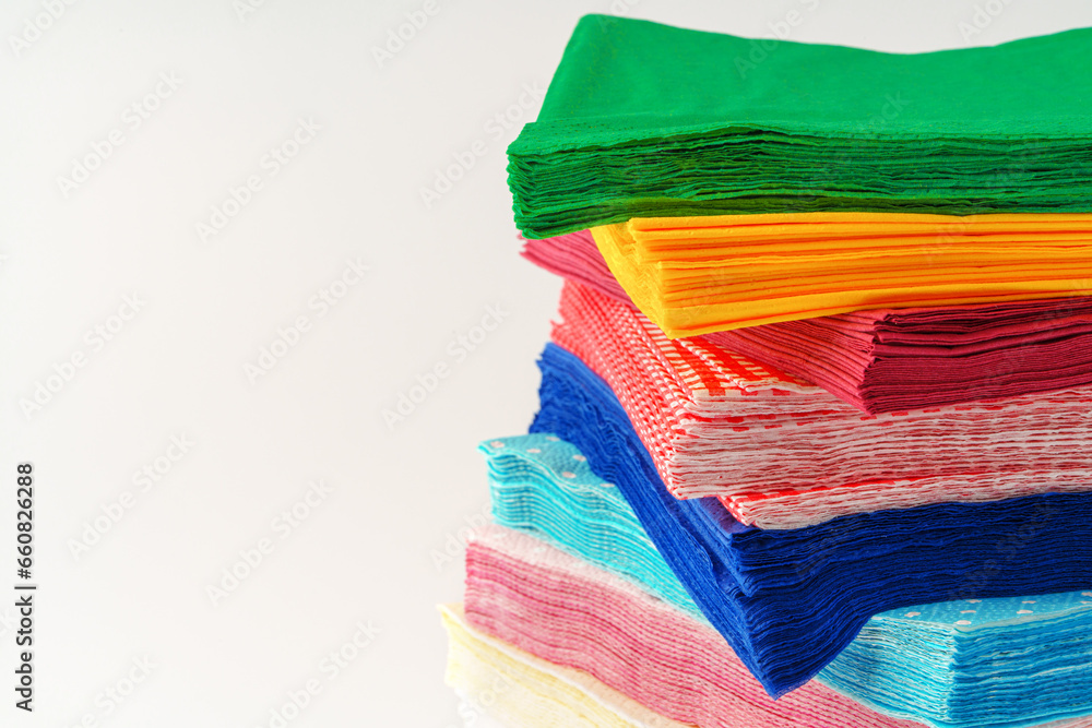 Fototapeta premium Colorful stack of paper napkins on white background