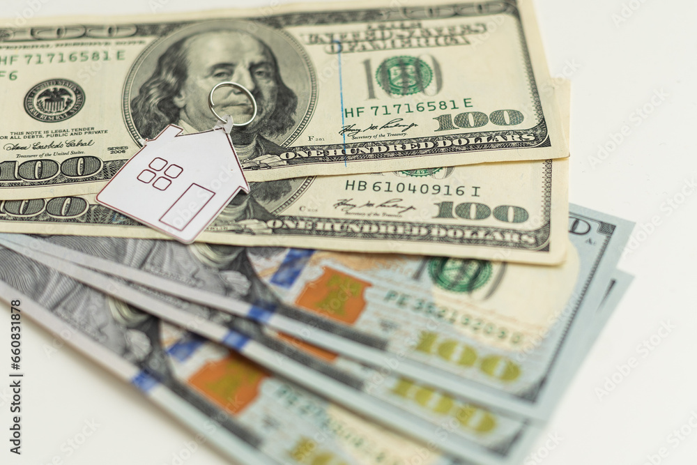house layout and dollar bills on the background house layout and dollar bills on the background