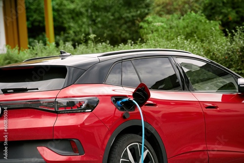 Isolated close-up of wall EV charger. Recharging sustainable transport at home. EV charger in a residential house. Clean power. Future transport technology.