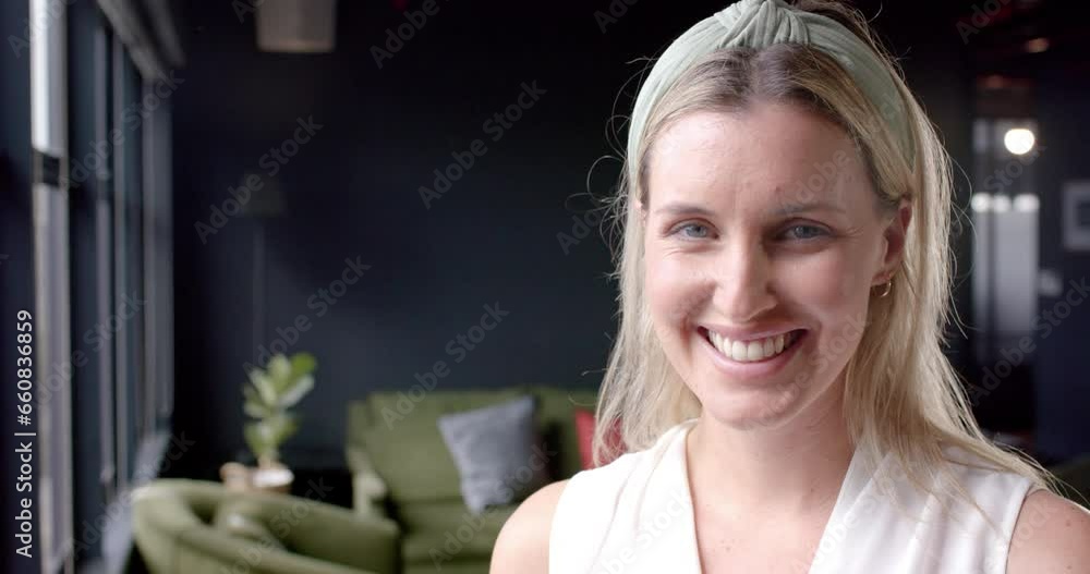 Portrait of smiling caucasian businesswoman in office with copy space Portrait of smiling caucasian businesswoman in office with copy space