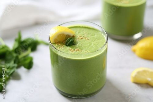 matcha smoothie garnished with a sliced lime on the rim