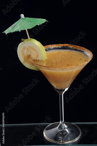Guava Cocktail Mocktail shot against a white background with garnish and props photo