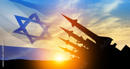 Fotografia The missiles are aimed at the sky at sunset with Israel flag