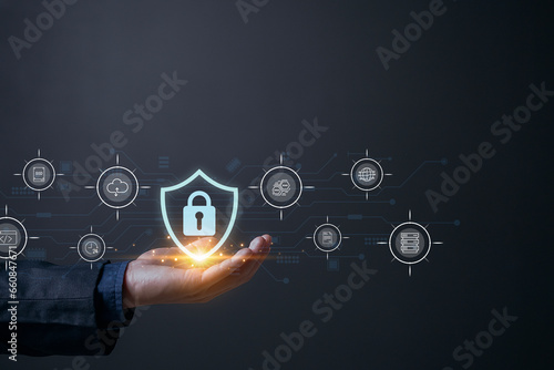 Fototapeta Naklejka Na Ścianę i Meble -  Businessman holding internet network security padlock, encryption security of personal data of users, Cyber security and network data protection.