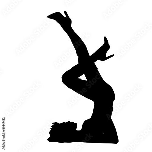 Silhouette of a slim female model in sexy pose. Silhouette of a woman wearing high heels in seductive pose.
