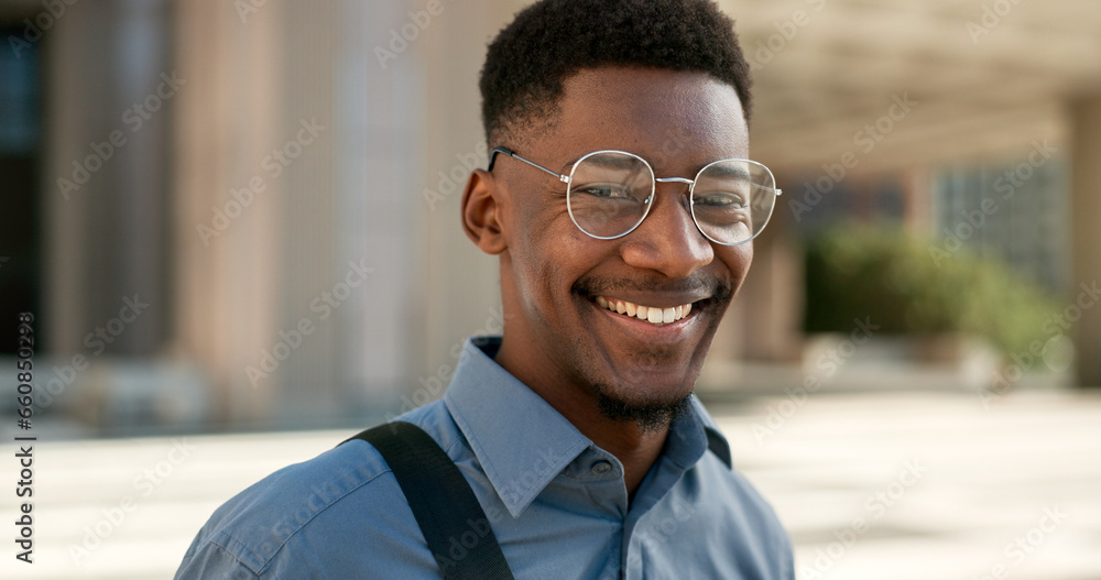 Business, face and happy black man with glasses in a city for travel, commute or outdoor morning trip. Portrait, smile and confident African male design intern excited to begin new job or career Business, face and happy black man with glasses in a city for travel, commute or outdoor morning trip. Portrait, smile and confident African male design intern excited to begin new job or career