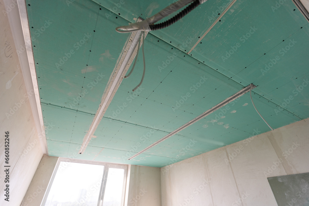 Construction worker installation ceiling work Construction worker installation ceiling work