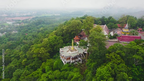 Aerial drone view of Wat Phra That Khao Noi with a fantastic view of Mueang Nan District in morning, Thailand