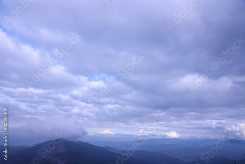Morning view from the Dragobrat mountain peaks in Carpathian mountains, Ukraine. Cloudy and foggy landscape around Drahobrat Peaks