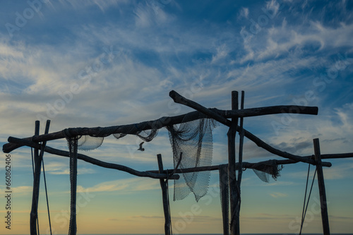 Wooden frame with fisher nets and blue sky