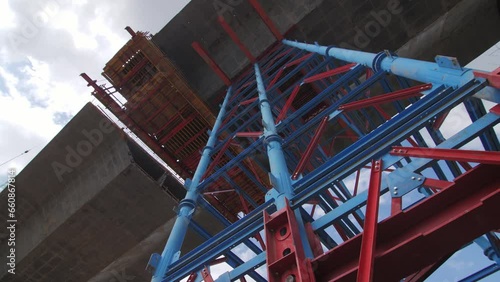 Wallpaper Mural Color frames scaffolds supports incomplete traffic bridge section at construction site. Transport overpass installing with building equipment Torontodigital.ca